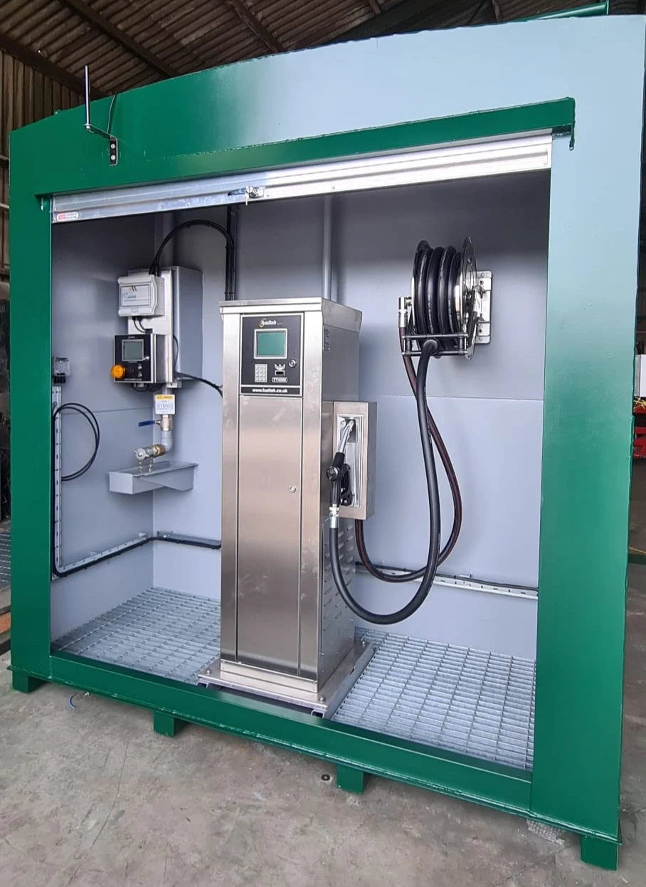 Genuine Fueltek dispenser, control unit, nozzle and hose reel installed in a tank equipment bay